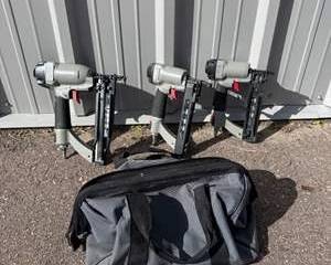 Set of Three Gray and Black Porter Cable Pneumatic Nail Guns with Carry Bag
