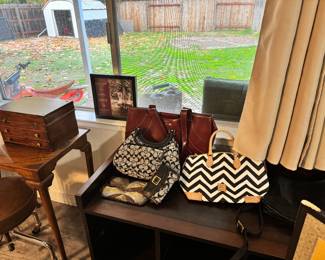 Vintage table. Name brand purses and bags. Never used