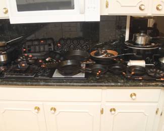 Large assortment of old cast iron cookware