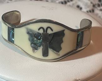 There is a nice collection of Sterling silver jewelry, including this beautiful Alpaca cuff Bracelet!