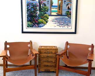 Sergio Rodrigues wood and leather Kilin lounge chairs, Hotel California signed and numbered Howard Behrens wall art, vintage hard carved people’s republic of China chest of drawers