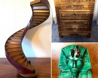 A handcrafted wooden architectural model of a spiral staircase, People’s republic of China hand carved chest of drawers and a funerary mask of the ancient Egyptian pharaoh Tutankhamun.
