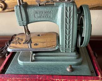 Betsy Ross Hand-Crank Sewing Machine in Red Carrying Case (Mid-20th Century)A charming relic of postwar ingenuity, this Betsy Ross hand-crank sewing machine combines practical design with vintage appeal. Housed in its distinctive red carrying case, this compact model reflects the era’s emphasis on portability and craftsmanship. The hand-crank mechanism and decorative detailing make it both a functional tool and a collectible display piece.
🧵 Details:
Maker: Betsy Ross Sewing Machine Co.
Era: Circa 1940s–1950s
Type: Portable hand-crank sewing machine
Features: Original red carrying case, built-in crank handle, and chrome detailing
Condition: Excellent vintage condition with light surface wear; mechanism appears complete but untested
Dimensions: Approx. 12” W × 7” H × 6” D
An ideal collectible for vintage sewing enthusiasts, decorators, or anyone drawn to the nostalgia and craftsmanship of mid-century domestic design.