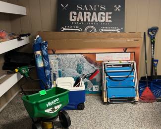 Spreader, cooler, beach chairs, umbrellas