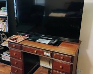 Flat screen TV with desk