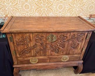 Upgrade your dining experience with this beautiful wood carved Asian inspired buffet