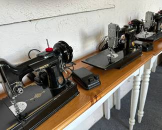 Three Singer Featherweight machines