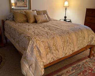 Solid wood bed featuring a timeless spindle-leg design and warm honey finish.