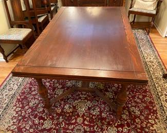 Antique Jacobean style oak dining table with pull out leaves and barley twist legs