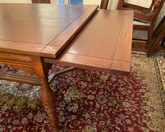 Antique Jacobean style oak dining table with pull out leaves and barley twist legs