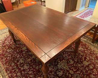 Antique Jacobean style oak dining table with pull out leaves and barley twist legs