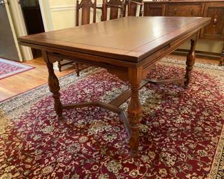 Antique Jacobean style oak dining table with pull out leaves and barley twist legs