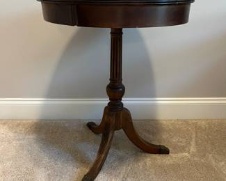 C85 - $85. Round Wooden Side Table with Brass Feet. Measures 20" round x 25.75" tall. Top does have some water rings. Solid wood.