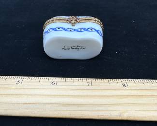 J15 - $60. Marked on the bottom "Limoges France Peint Main P.V." hinged trinket box.
