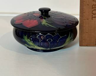 C9 - $125. Moorcroft Pottery, Cobalt Blue, Anemone Lidded Dish. Measures 5" wide x 3" tall.