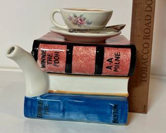 C43 - $30. Vintage Tony Carter Teapot with Stack of Books & Cup.