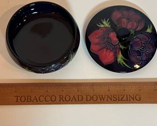 C9 - $125. Moorcroft Pottery, Cobalt Blue, Anemone Lidded Dish. Measures 5" wide x 3" tall.