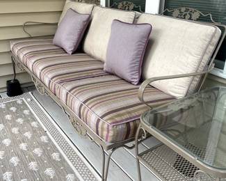 C115 - $225. Wrought Iron Couch with cushions. Measures 74" wide x 31" deep x 33" tall. No name. Solid piece in very good condition. Used on covered, screened in porch.