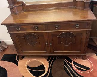 C3 - $1,750. English Renaissance Revival Sideboard. Appraisal dates it to late 19th century. Measures 60" wide x 22.5" deep x 77" tall. Loose fretwork on both sides and missing minor trim pieces. Sturdy and GORGEOUS! Homeowner shipped it back from England in the 90s.