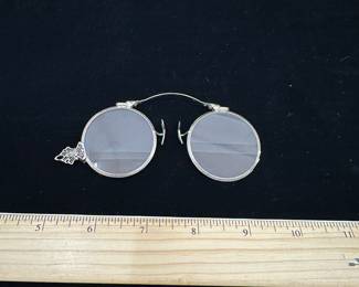 J29 - $250. 14kt gold glasses frames with lenses.