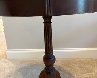 C85 - $85. Round Wooden Side Table with Brass Feet. Measures 20" round x 25.75" tall. Top does have some water rings. Solid wood.