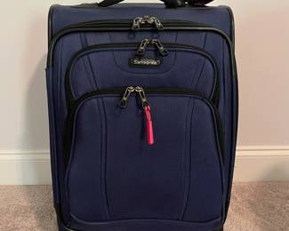 C98 - $40. Samsonite Rolling Luggage with spinner wheels. Measures 15" x 10" x 22.5" tall.