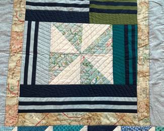 Q18 - $60. Like New Quilt. Measures 45" x 57.5" (lap / throw quilt)