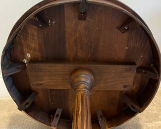 C85 - $85. Round Wooden Side Table with Brass Feet. Measures 20" round x 25.75" tall. Top does have some water rings. Solid wood.