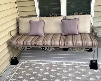 C115 - $225. Wrought Iron Couch with cushions. Measures 74" wide x 31" deep x 33" tall. No name. Solid piece in very good condition. Used on covered, screened in porch.