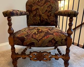 C86 - $250. Single Upholstered Arm Chair. Measures 25" wide x 17" deep x 33" tall. Sturdy with beautifully carved wood frame.