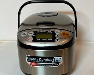 C51 - $60. Zojirushi 3 Cup Rice Cooker. Model NS-LAC05.