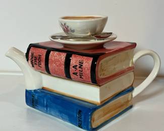 C43 - $30. Vintage Tony Carter Teapot with Stack of Books & Cup.