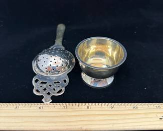 J38 - $10. Unmarked Silver plated tea strainer.