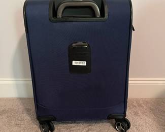 C98 - $40. Samsonite Rolling Luggage with spinner wheels. Measures 15" x 10" x 22.5" tall.