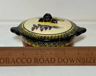 C30 - $20. Quimper Lidded Dish. Measures 6.5" x 2.5" tall. Has small chip on lid handle and small chip on dish handle.