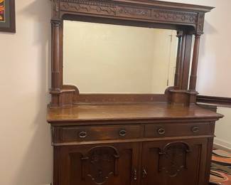 C3 - $1,750. English Renaissance Revival Sideboard. Appraisal dates it to late 19th century. Measures 60" wide x 22.5" deep x 77" tall. Loose fretwork on both sides and missing minor trim pieces. Sturdy and GORGEOUS! Homeowner shipped it back from England in the 90s.