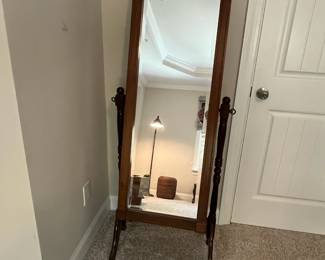 C90 - $350. American Eastlake Cheval Dressing Mirror - circa 1920s. Measures 25" wide x 19" deep x 60" tall. Carved flowers on top and bottom of frame. In very good antique condition.