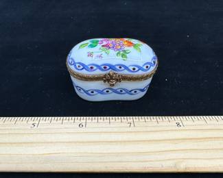 J15 - $60. Marked on the bottom "Limoges France Peint Main P.V." hinged trinket box.