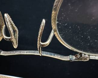 J29 - $250. 14kt gold glasses frames with lenses.