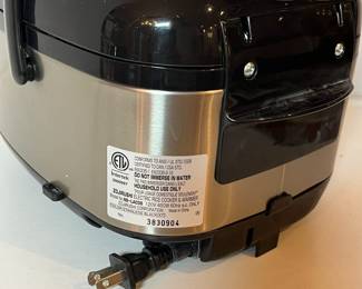 C51 - $60. Zojirushi 3 Cup Rice Cooker. Model NS-LAC05.