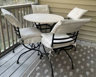 C120 - $350. Wrought Iron Chairs & Table Base. Cushions could use a wash but overall very good condition. Table is 32" round x 29" tall. 4 Chairs are 18" wide x 18" deep x 36" tall. Stone Top is Removable from table for transport. Beautiful heavy set.