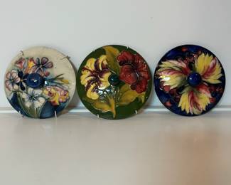 C10 - $50 Each. All 3 for $120. Moorcroft Pottery *LIDS* used as wall decor. Have the wall hanging attachment on them still. No dishes to match - LIDS ONLY.