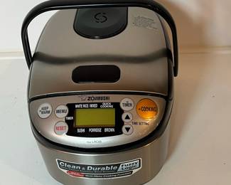 C51 - $60. Zojirushi 3 Cup Rice Cooker. Model NS-LAC05.