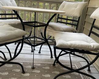 C120 - $350. Wrought Iron Chairs & Table Base. Cushions could use a wash but overall very good condition. Table is 32" round x 29" tall. 4 Chairs are 18" wide x 18" deep x 36" tall. Stone Top is Removable from table for transport. Beautiful heavy set.