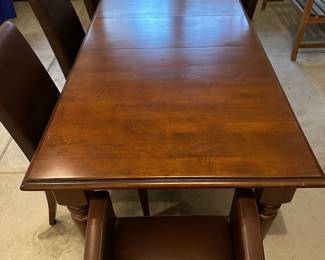 C4 - $1,500. Pottery Barn Table with 8 chairs. Table has 2 leaves. 2 captains chairs. 6 regular chairs. Measures 40" wide x 6' long with NO leaves in. Set includes 2 - 16" leaves. When all together it is 104". Table surface has some gentle wear marks but no huge gouges or issues. Chairs are all in very good condition. Most were scattered around the house in guest bedrooms and not regularly used.