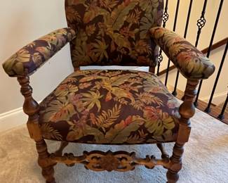 C86 - $250. Single Upholstered Arm Chair. Measures 25" wide x 17" deep x 33" tall. Sturdy with beautifully carved wood frame.