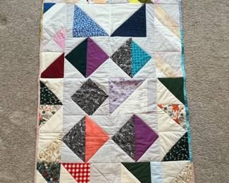 Q19 - $50. Like New Quilt. Measures 29" x 42.5" (lap / throw size)