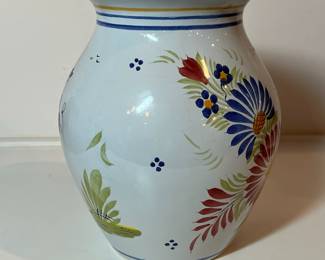 C15 - $50. Quimper Vase Breton Man on one side - floral design on the other. Signed "Henriot Quimper France D 201 F 637 P." Measures 5.75" x 8.5".