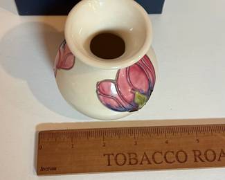 C8 - $100. Ivory Moorcroft Pottery Centenary Pink Magnolia Pattern Vase. Measures 3.5" tall.