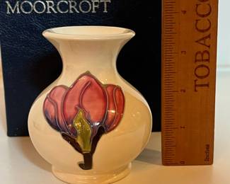 C8 - $100. Ivory Moorcroft Pottery Centenary Pink Magnolia Pattern Vase. Measures 3.5" tall.